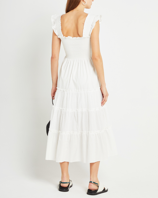 Second image of Calypso Maxi Dress, a white maxi dress, swiss dot material, smocked bodice, ruffles cap sleeves 