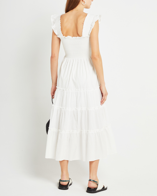 Second image of Calypso Maxi Dress, a white maxi dress, swiss dot material, smocked bodice, ruffles cap sleeves
