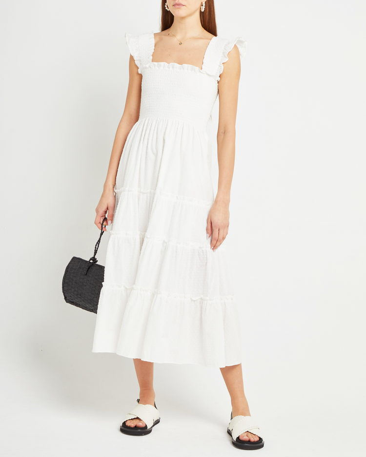 Third image of Calypso Maxi Dress, a white maxi dress, swiss dot material, smocked bodice, ruffles cap sleeves