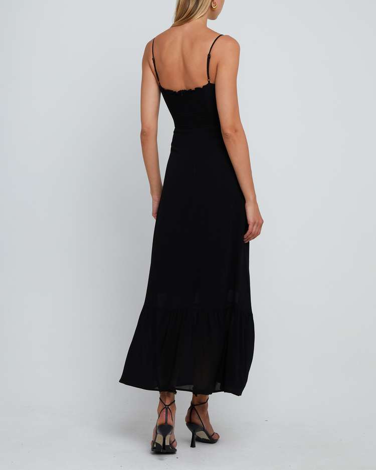 Fourth image of Evelyn Dress, a black bridesmaid maxi-length dress with ruched bust detail, sweetheart neckline, tiered skirt, back smocking, adjustable straps, back zipper, and lining