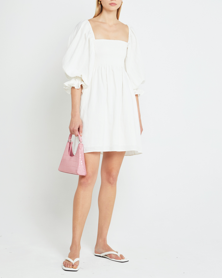 First image of Portia Mini Dress, a white mini dress, puff sleeves, smocked, square neckline
