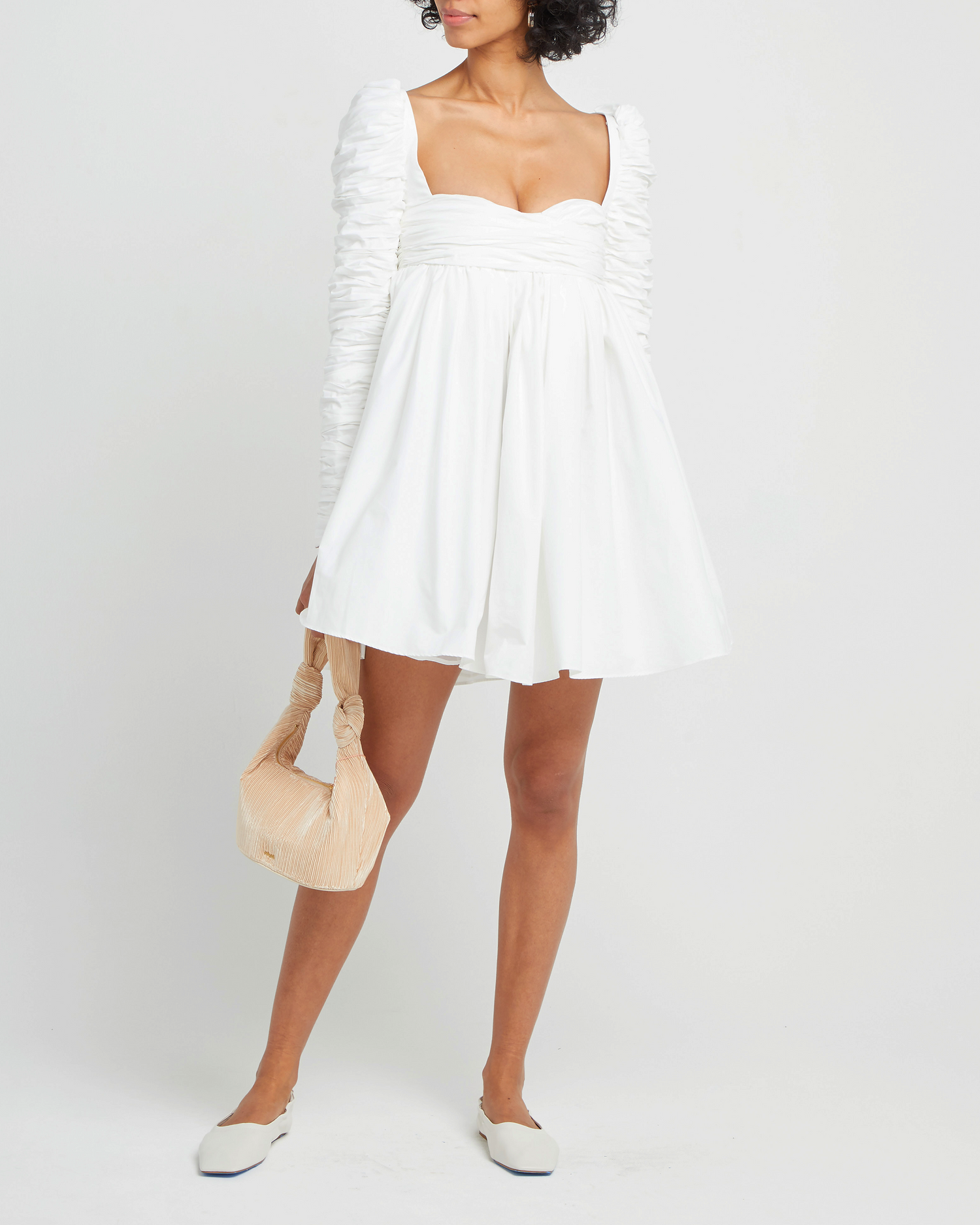 First image of Structured Long-Sleeve Frock, a white mini dress, babydoll, long ruched sleeves, square neckline