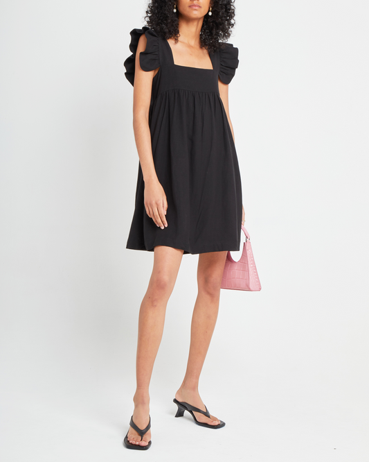 First image of Aria Dress, a black mini dress, ruffle sleeves, retro, babydoll, square neckline