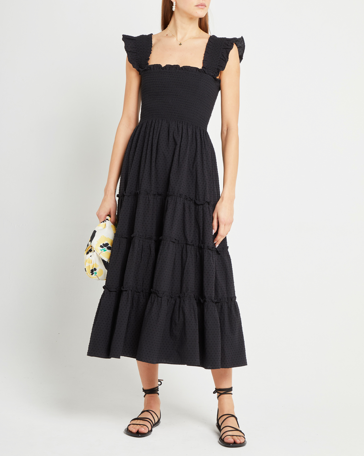 First image of Calypso Maxi Dress, a black maxi dress, swiss dot material, smocked bodice, ruffles cap sleeves 