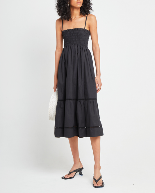 First image of Cotton Leila Dress, a black midi dress, spaghetti strap, smocked bodice, tiered skirt