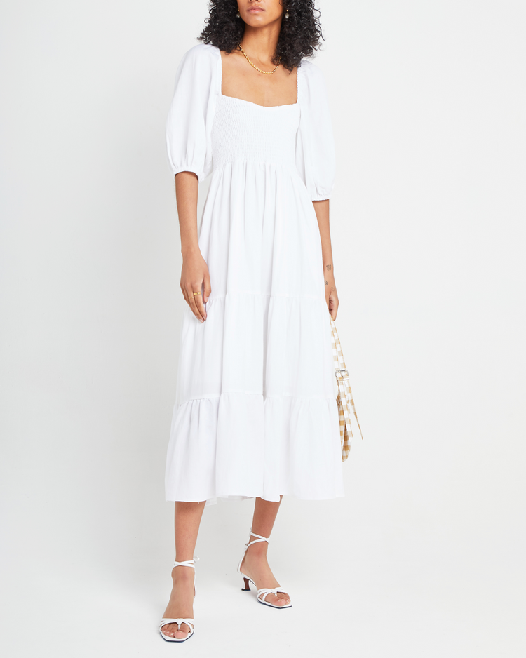 First image of Hera Dress, a white midi dress, smocked bodice, puff sleeves, short sleeves