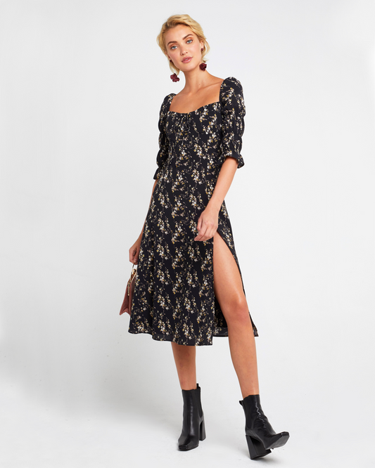 First image of She's Picky Dress, a black midi dress, puff sleeves, 3/4 sleeves, fall, floral, side slit