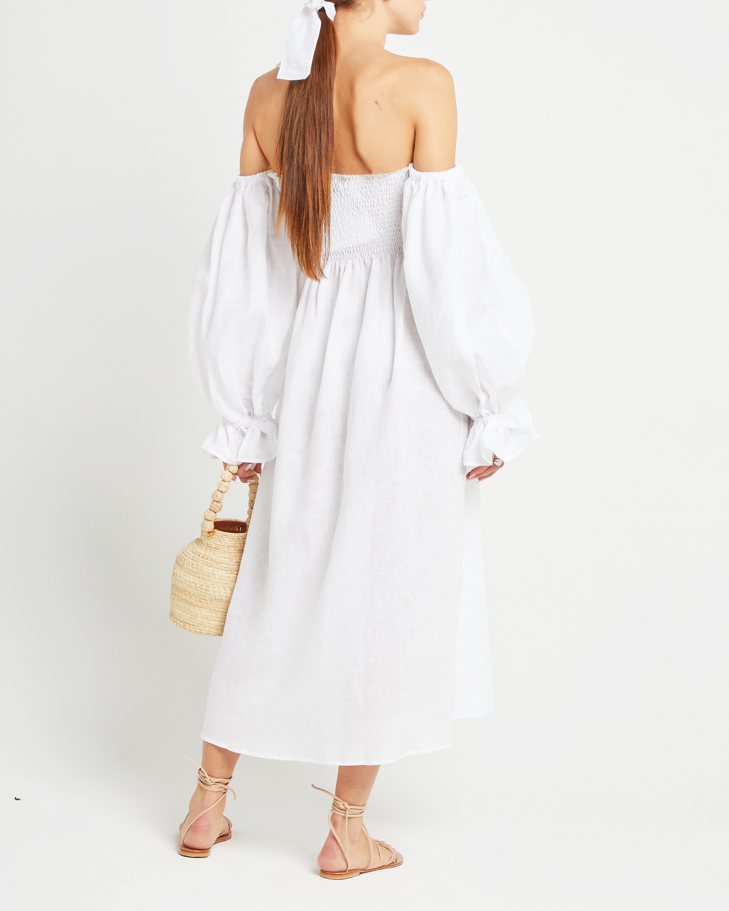 Second image of Athena Dress, a white midi dress, off shoulder, long sleeve, puff sleeves, smocked