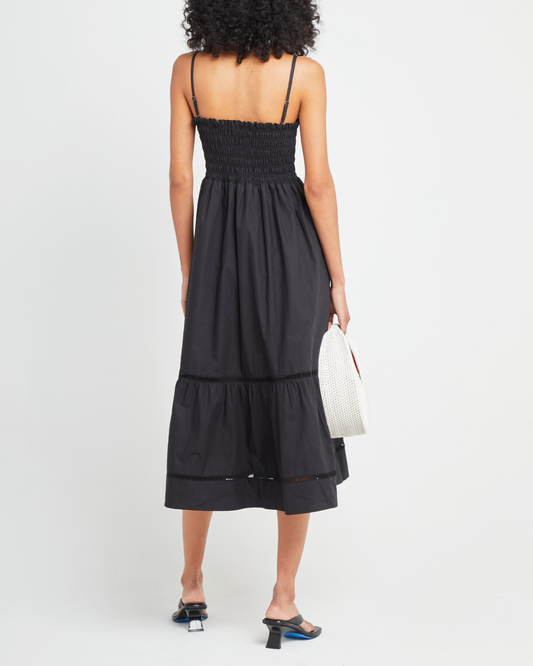 Second image of Cotton Leila Dress, a black midi dress, spaghetti strap, smocked bodice, tiered skirt