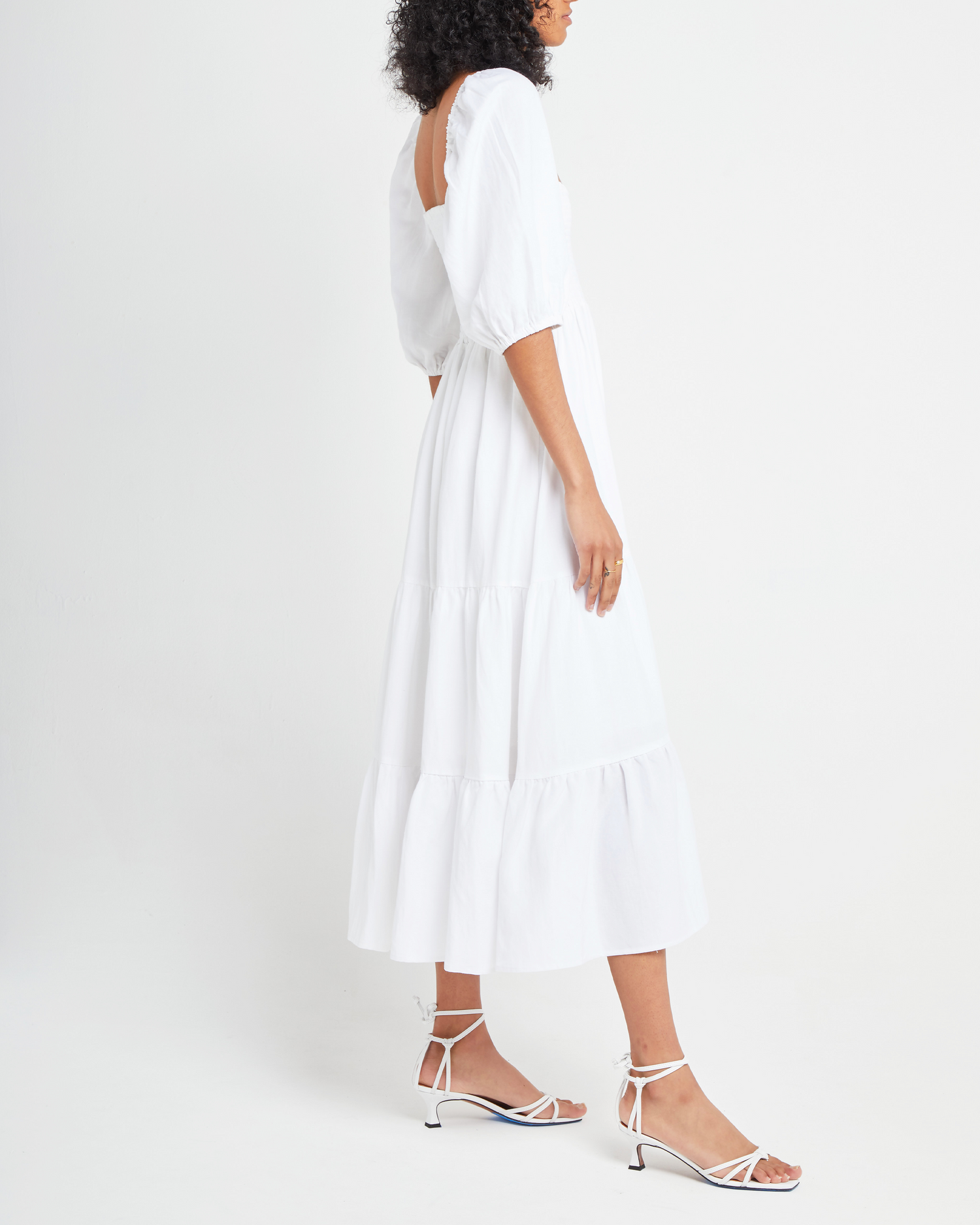 Third image of Hera Dress, a white midi dress, smocked bodice, puff sleeves, short sleeves
