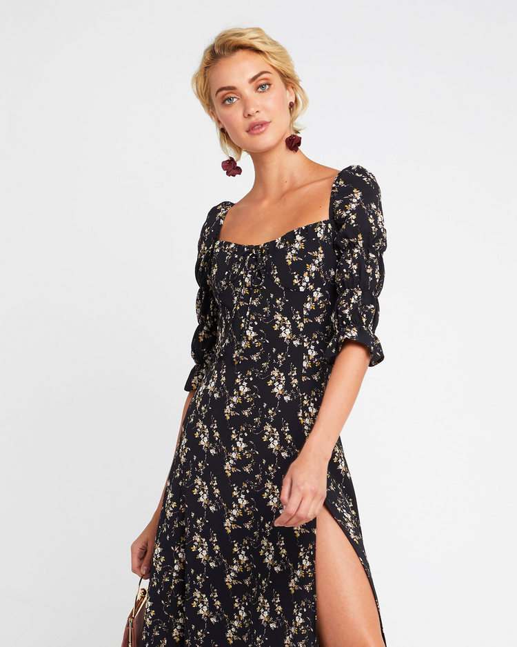 Fourth image of She's Picky Dress, a black midi dress, puff sleeves, 3/4 sleeves, fall, floral, side slit