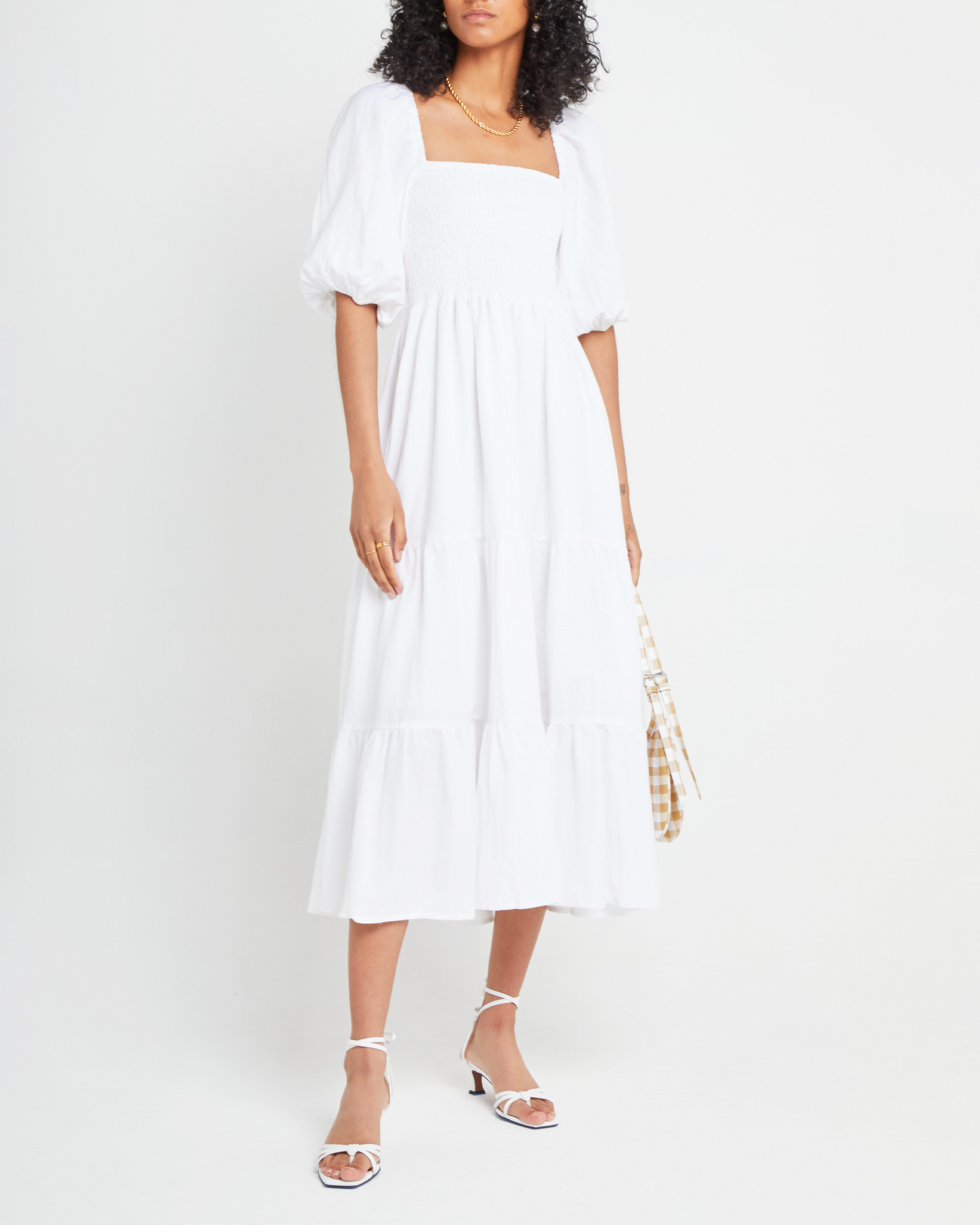 Fourth image of Hera Dress, a white midi dress, smocked bodice, puff sleeves, short sleeves
