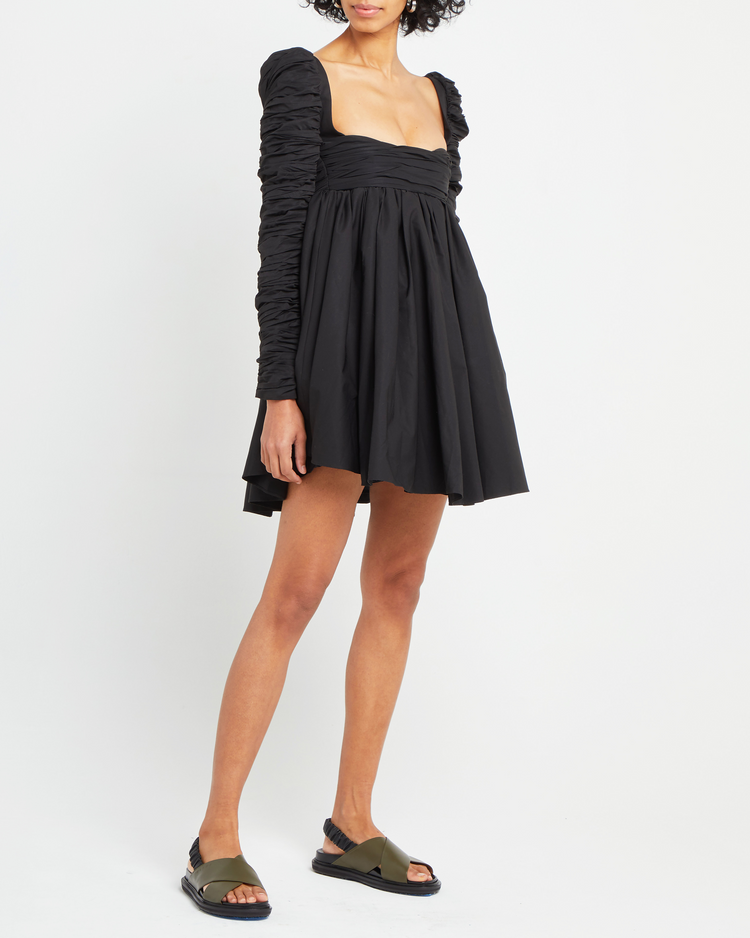 Fifth image of Structured Long-Sleeve Frock, a black mini dress, babydoll silhouette, long ruched sleeves, square neckline