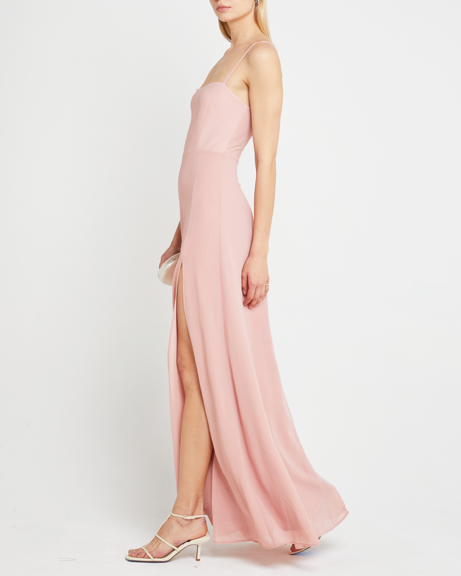 Second image of Jessica Maxi Dress, a pink wedding guest dress with back zipper, straight neckline, side slit, adjustable straps, smocked back detail, and lining