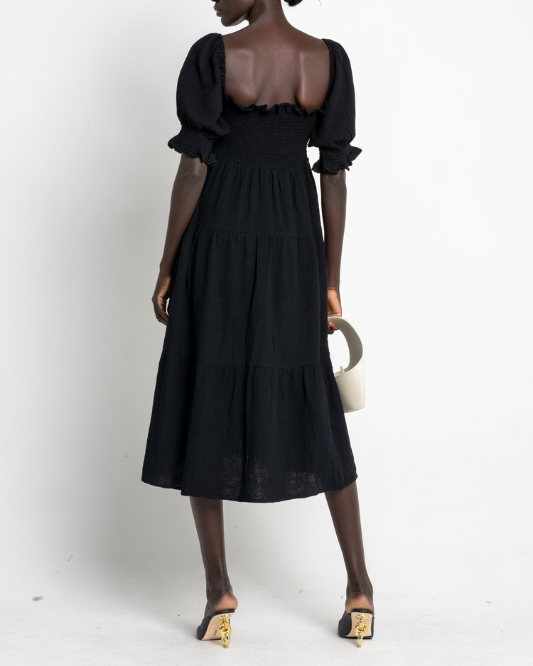 Second image of Frankie Dress, a black midi dress, puff sleeves, short sleeves