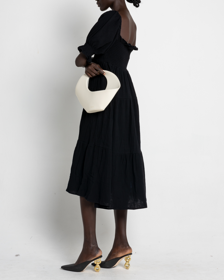 Fourth image of Frankie Dress, a black midi dress, puff sleeves, short sleeves