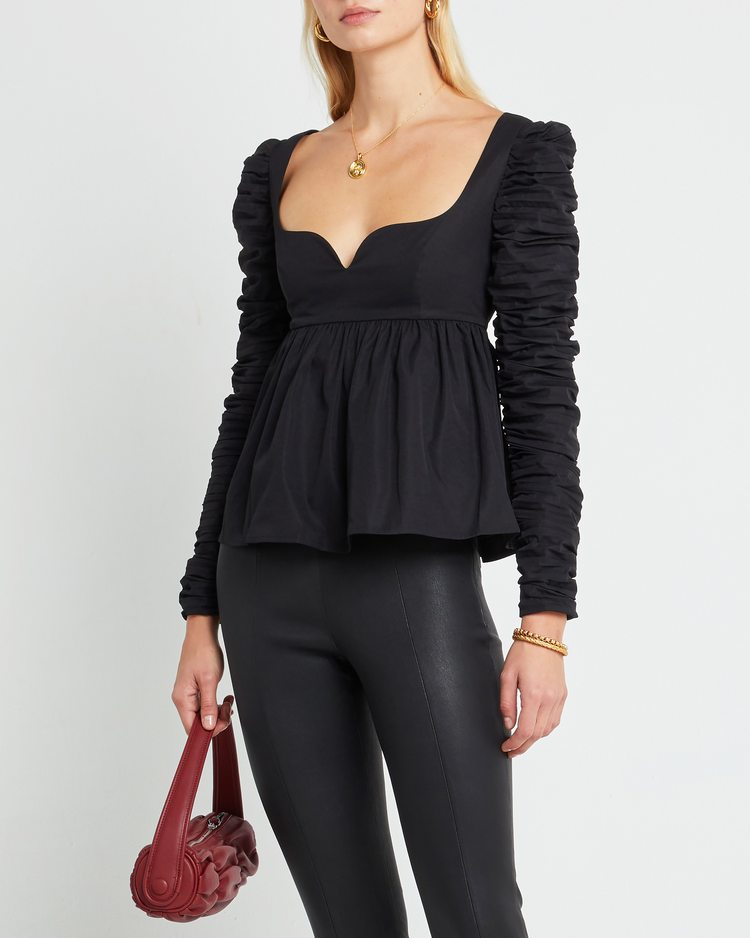 First image of Alice Top, a black long sleeve top, ruched, long sleeve, peplum