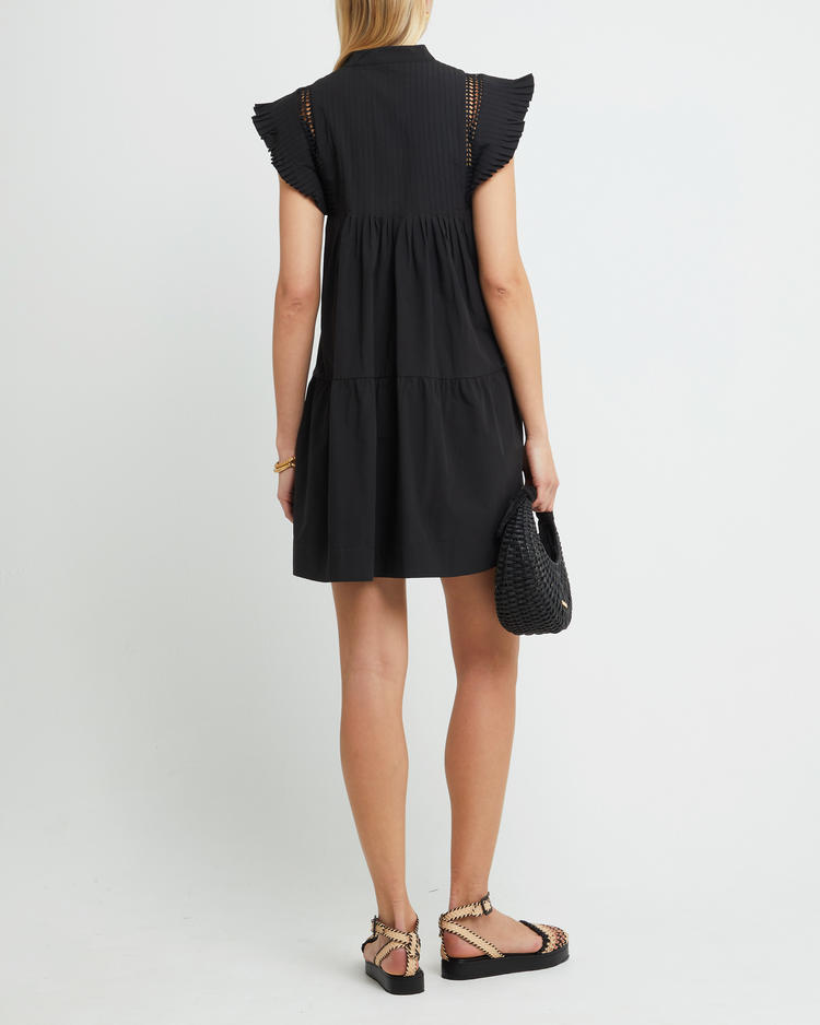 Second image of Callan Dress, a black mini dress, paneled, lace, ruffle sleeve, high neckline