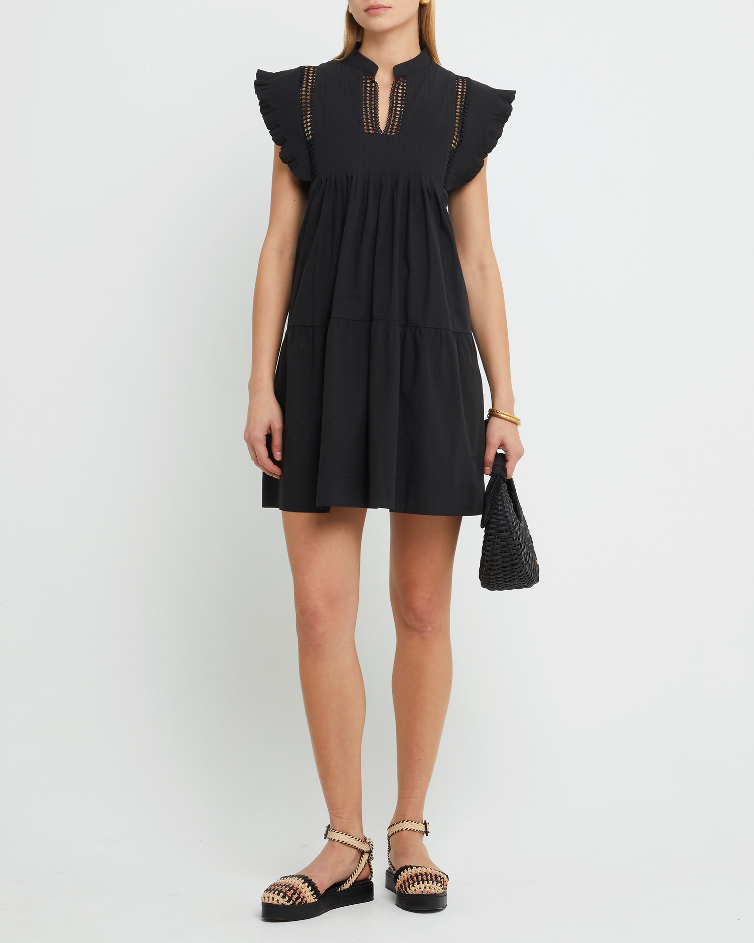 First image of Callan Dress, a black mini dress, paneled, lace, ruffle sleeve, high neckline