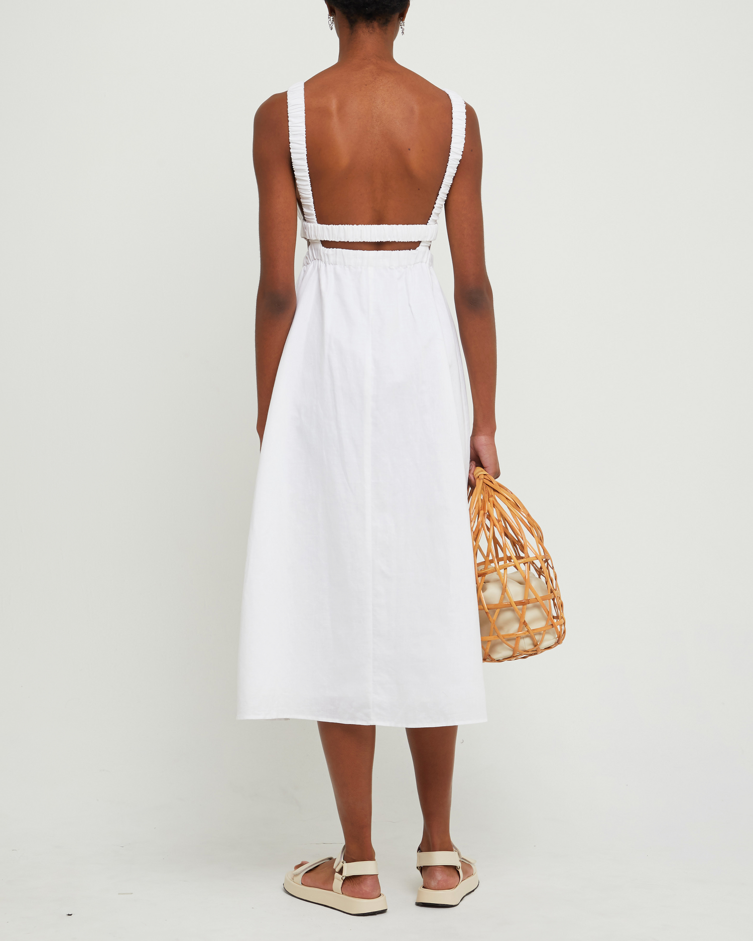 Fifth image of Aubrielle Dress, a white midi dress, open back, cut out, high neckline, sleeveless
