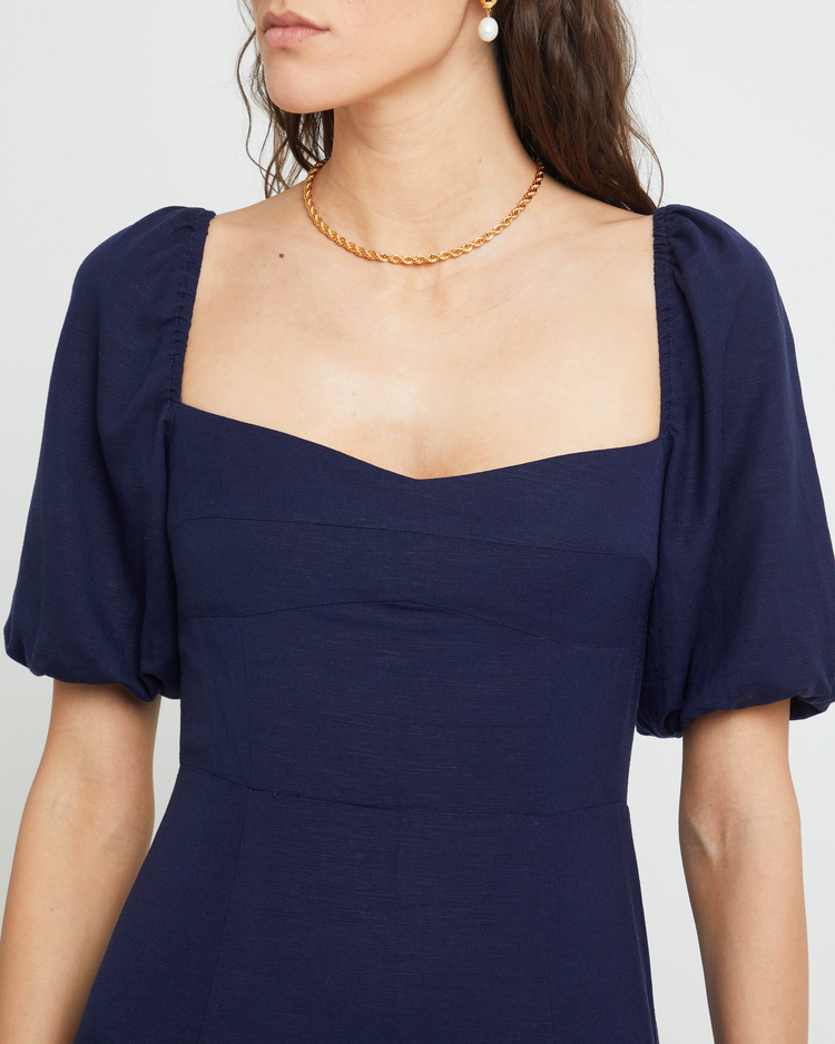 Sixth image of Violetta Midi Dress, a blue midi dress, sweetheart neckline, short sleeves, puff sleeves, side slit