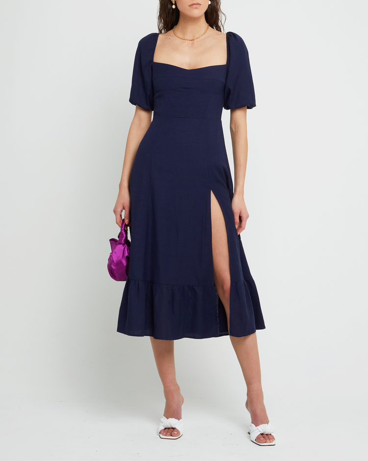 First image of Violetta Midi Dress, a blue midi dress, sweetheart neckline, short sleeves, puff sleeves, side slit