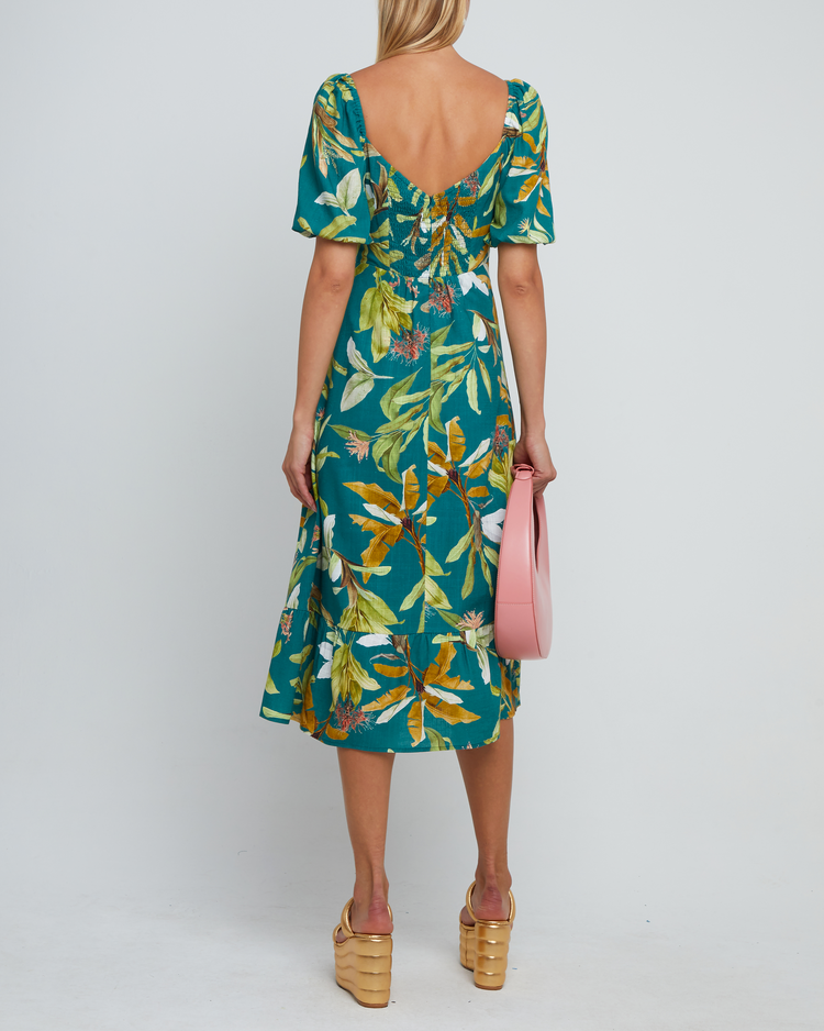 Second image of Violetta Midi Dress, a green midi dress, sweetheart neckline, short sleeves, puff sleeves, side slit, tropical print, floral