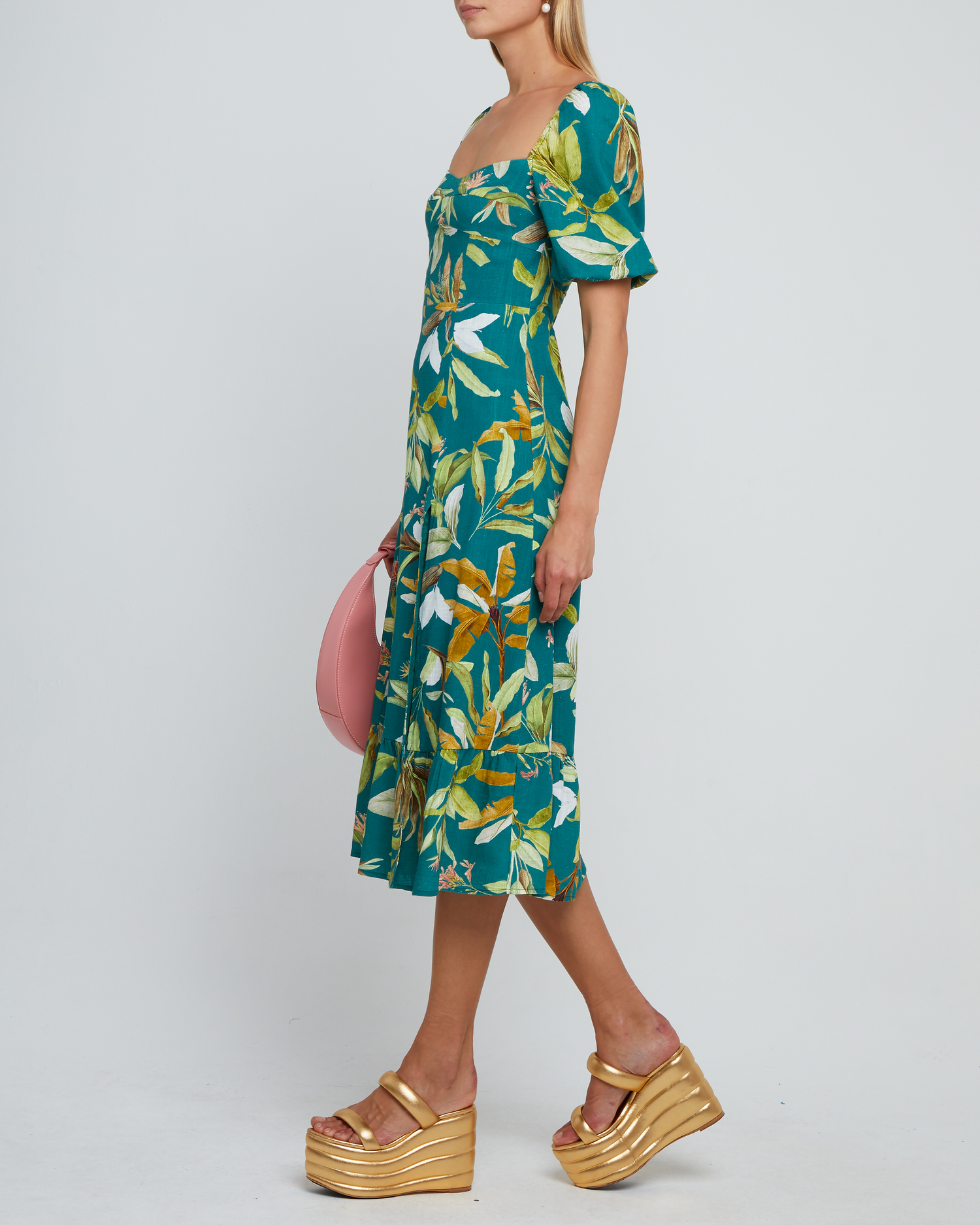 Third image of Violetta Midi Dress, a green midi dress, sweetheart neckline, short sleeves, puff sleeves, side slit, tropical print, floral