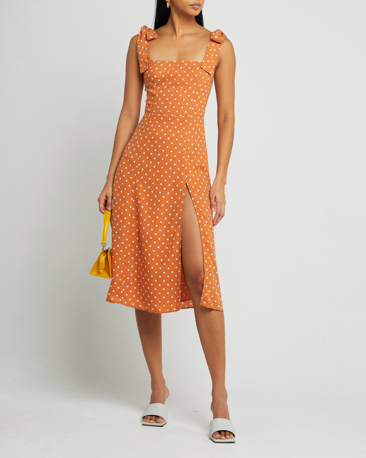 Fourth image of Sasha Dress, a orange midi dress, side slit, tie straps, bow, ribbon, polka dot