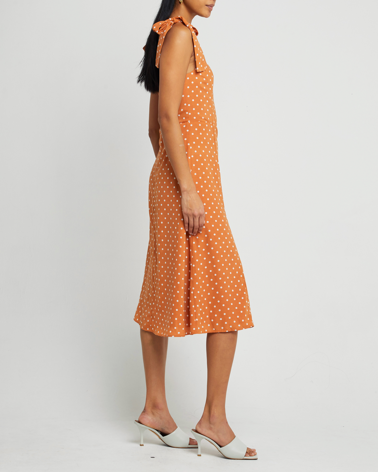Fifth image of Sasha Dress, a orange midi dress, side slit, tie straps, bow, ribbon, polka dot