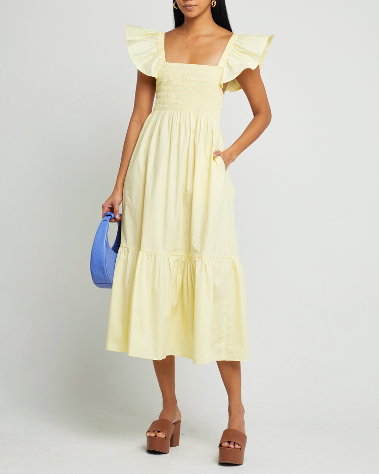 First image of Tuscany Dress, a yellow midi dress, smocked bodice, ruffled cap sleeves, pockets