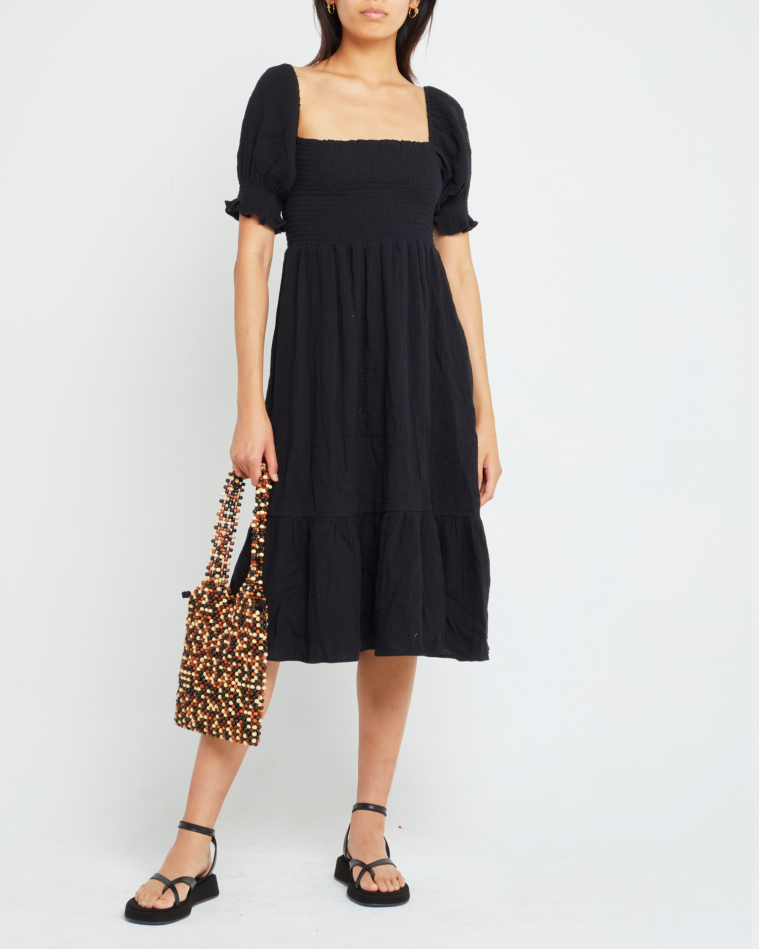 First image of Angie Dress, a black midi dress, puff sleeves, smocked bodice, square neckline