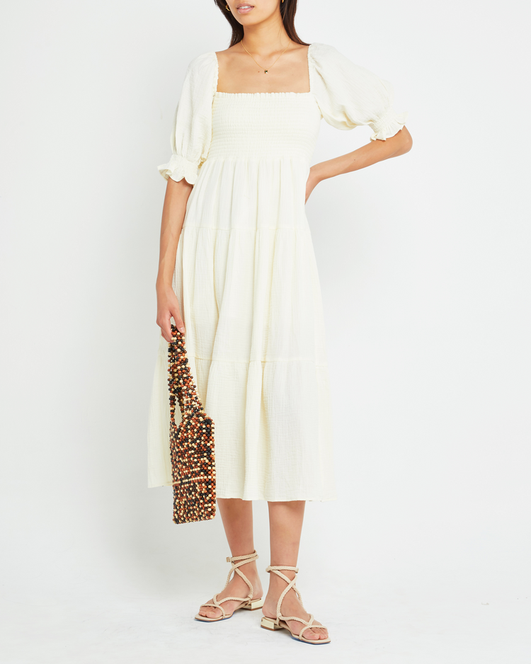 Fifth image of Frankie Dress, a white midi dress, smocked bodice, short sleeve, puff sleeve