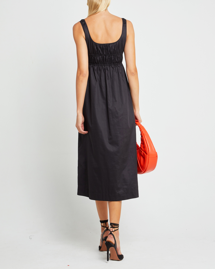 Second image of Moira Dress, a black midi dress, tie, side slit, gathering, fitted, empire waist