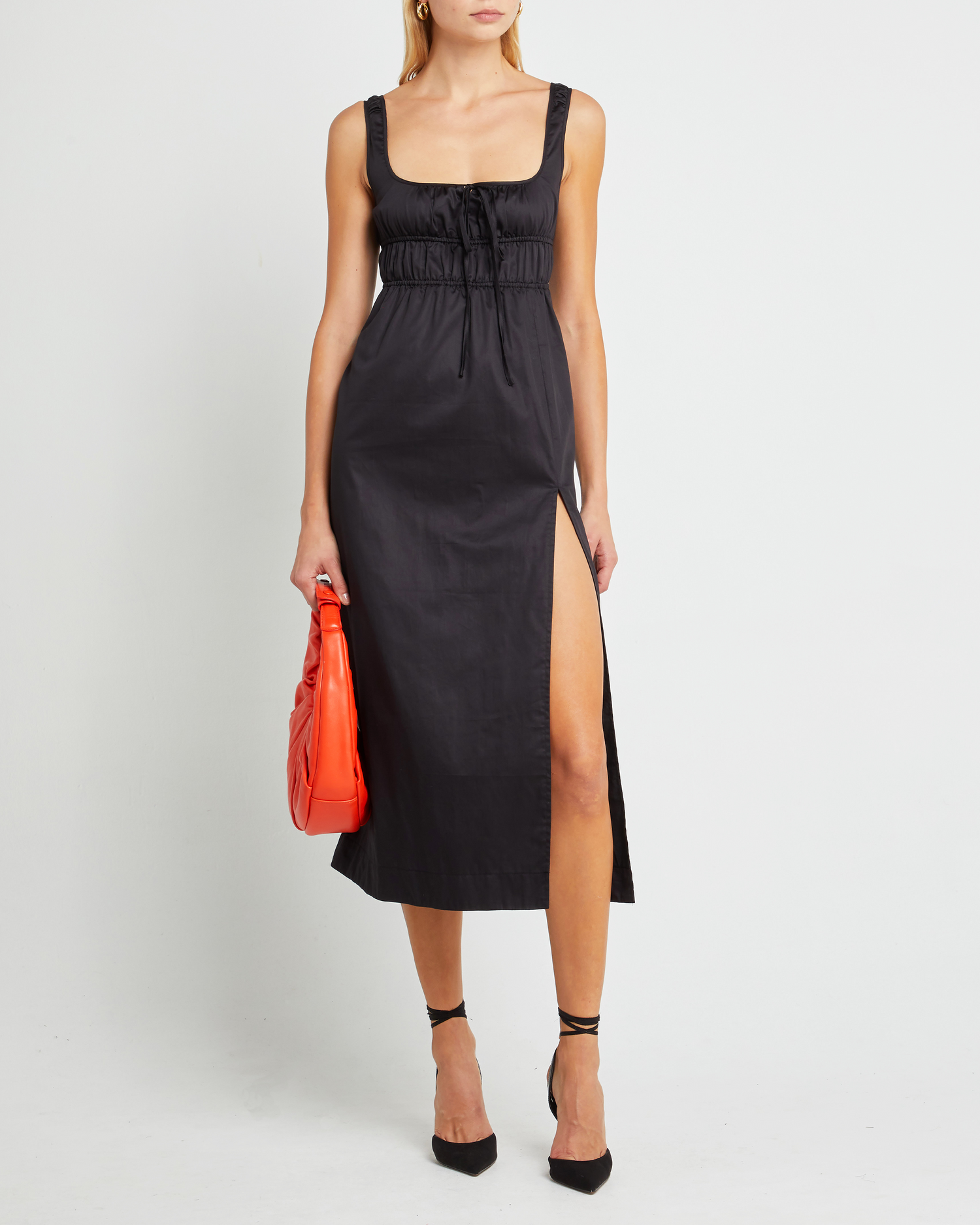 Fourth image of Moira Dress, a black midi dress, tie, side slit, gathering, fitted, empire waist