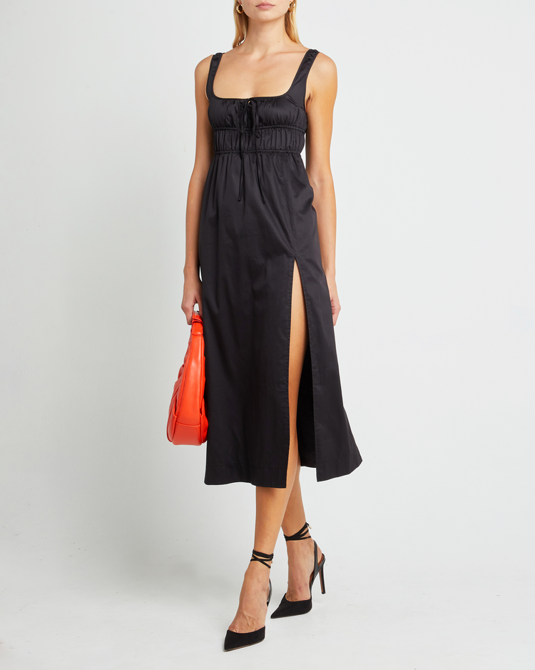 First image of Moira Dress, a black midi dress, tie, side slit, gathering, fitted, empire waist
