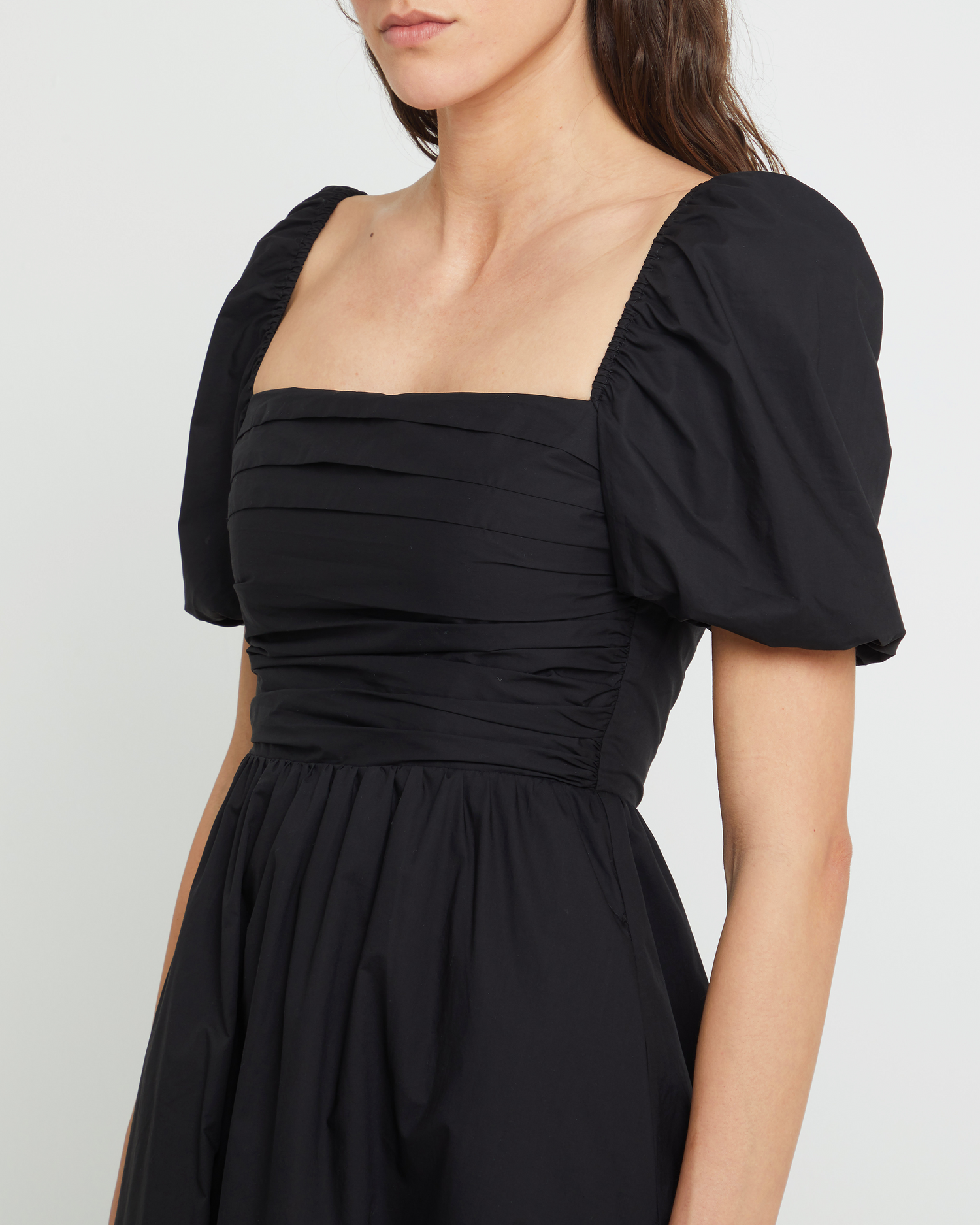 Fifth image of River Dress, a black midi dress, square neckline, short puff sleeves, gathered bodice