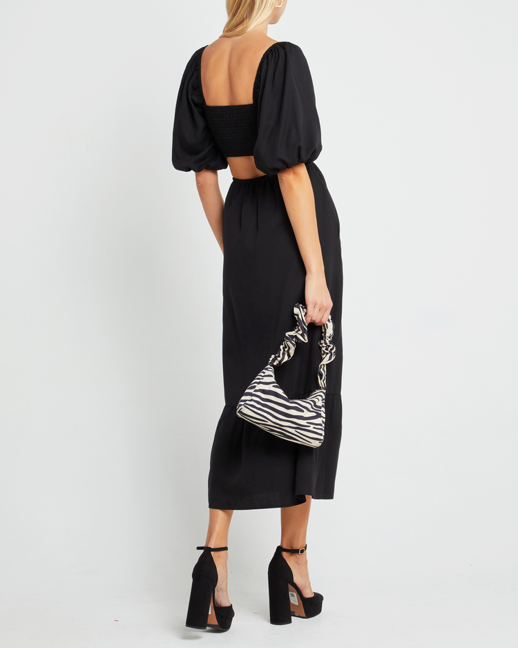 Second image of Leighton Dress, a black maxi dress, open back, short sleeve, puff sleeve, pocket, cut out