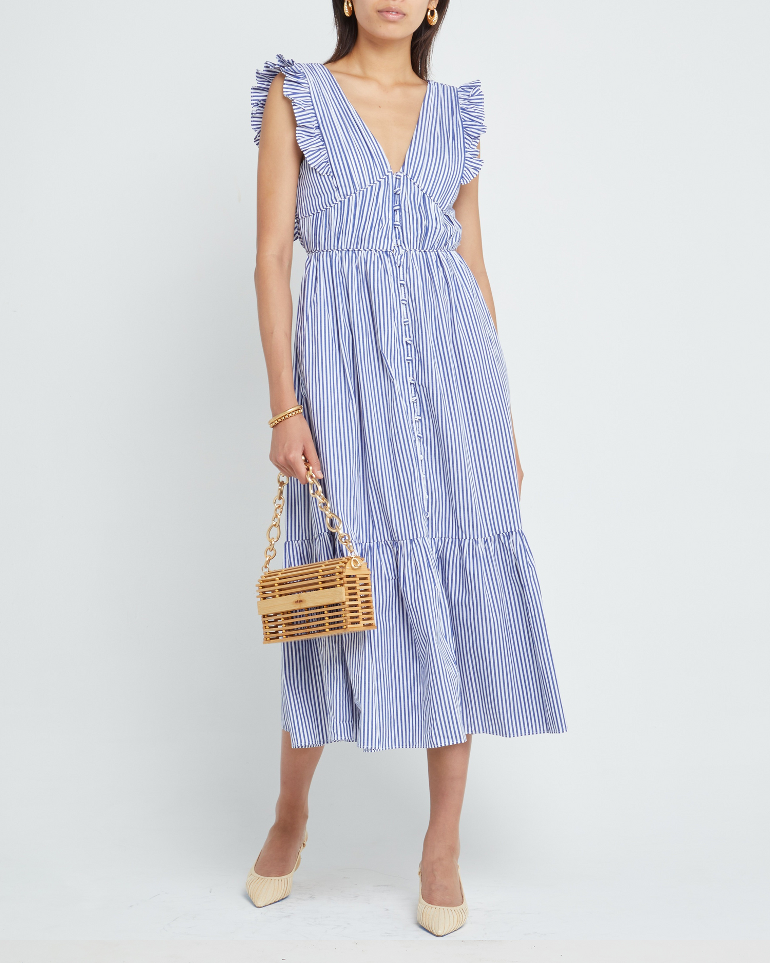 First image of Stella Dress, a blue midi dress, ruffle sleeves, V-neck, lace, tiered