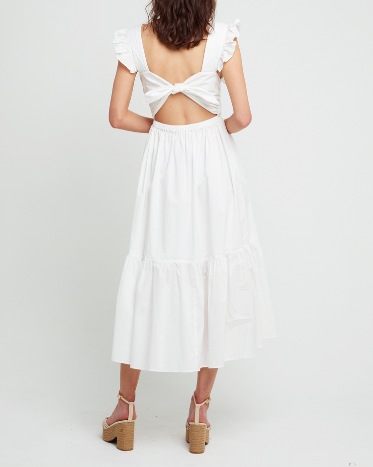 Second image of Stella Dress, a white midi dress, front buttons, ruffle sleeve, open back, tiered, tie, ribbon, bow