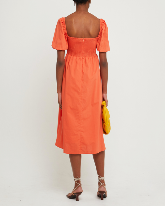Second image of River Dress, a orange midi dress, square neckline, short puff sleeves, gathered bodice