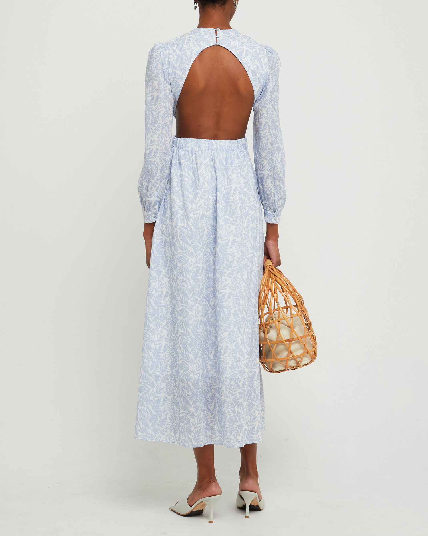 Second image of Kimia Cotton Dress, a blue maxi dress, open back, cut outs, V-neck, plunge, floral, long sleeves, puff sleeve