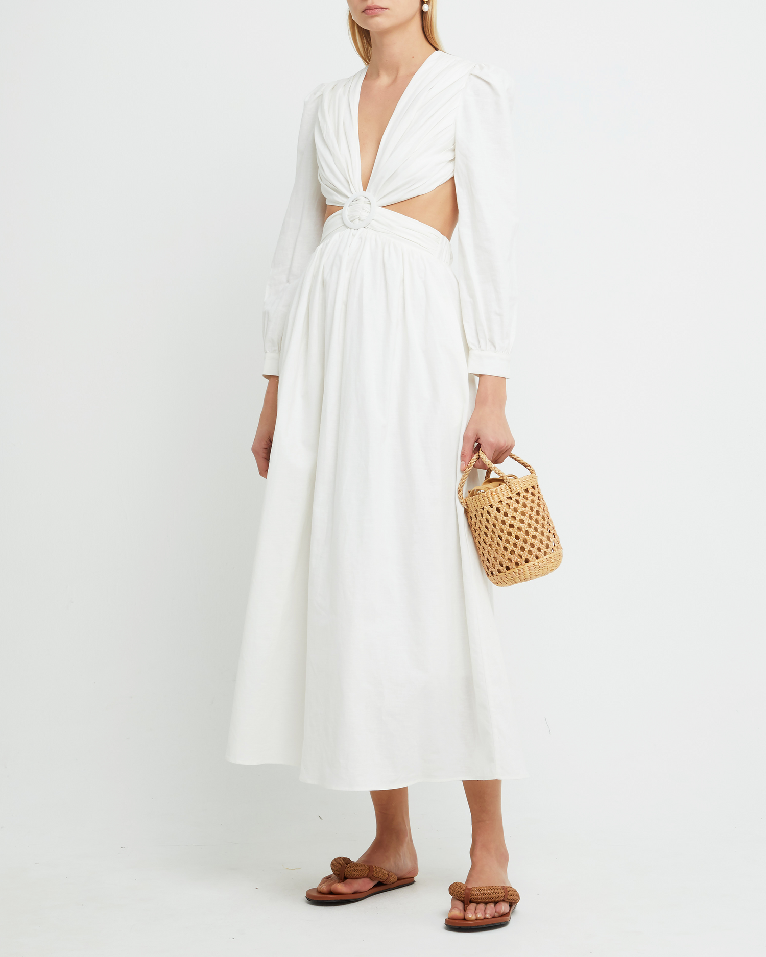First image of Kimia Dress, a white maxi dress, belt, cut out, open back, long sleeves, V-neck, plunge