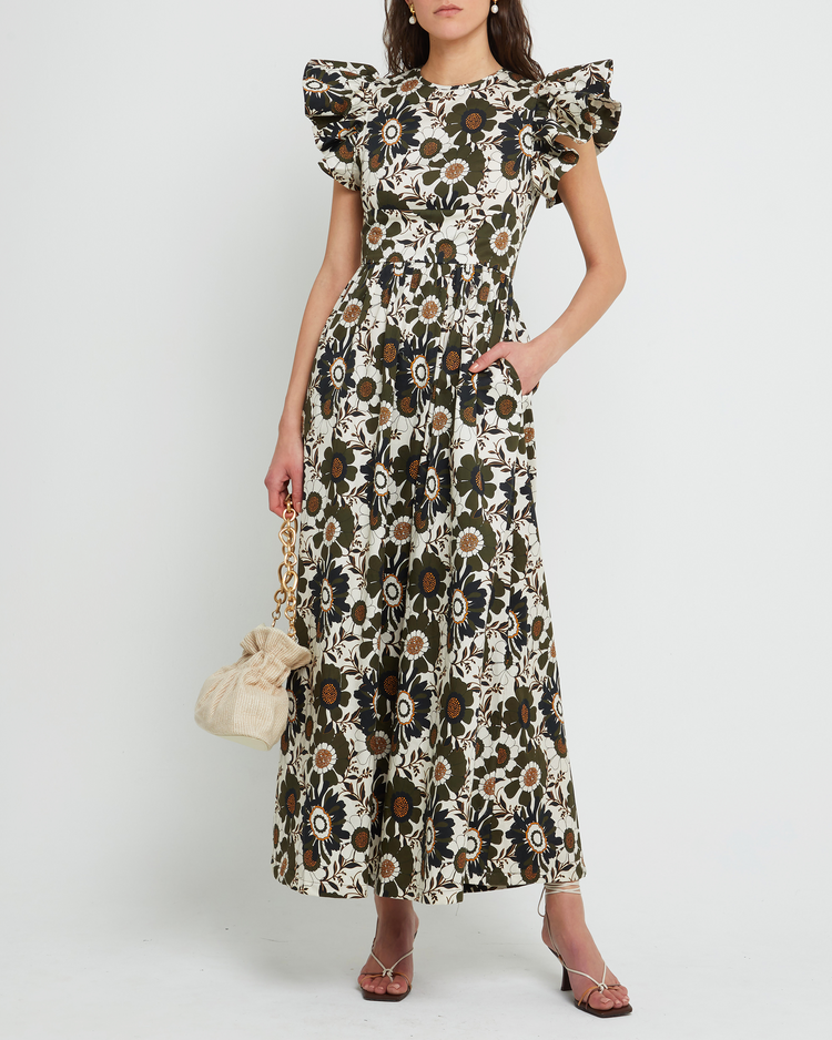 First image of Martinelli Dress, a white maxi dress, ruffle cap sleeves, pockets, floral print, bold, high neck