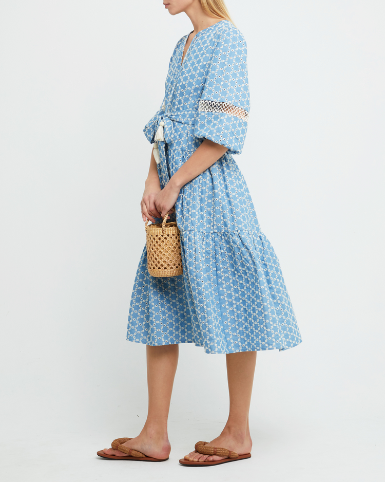 Third image of Haven Dress, a blue midi dress, lace detail, eyelet, waist tie, bow, wrap dress, puff sleeves