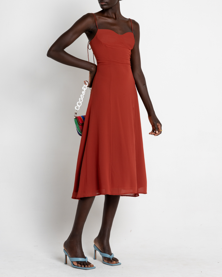 Third image of Venus Dress, a orange midi dress, tie straps, spaghetti straps, side slit, bodice