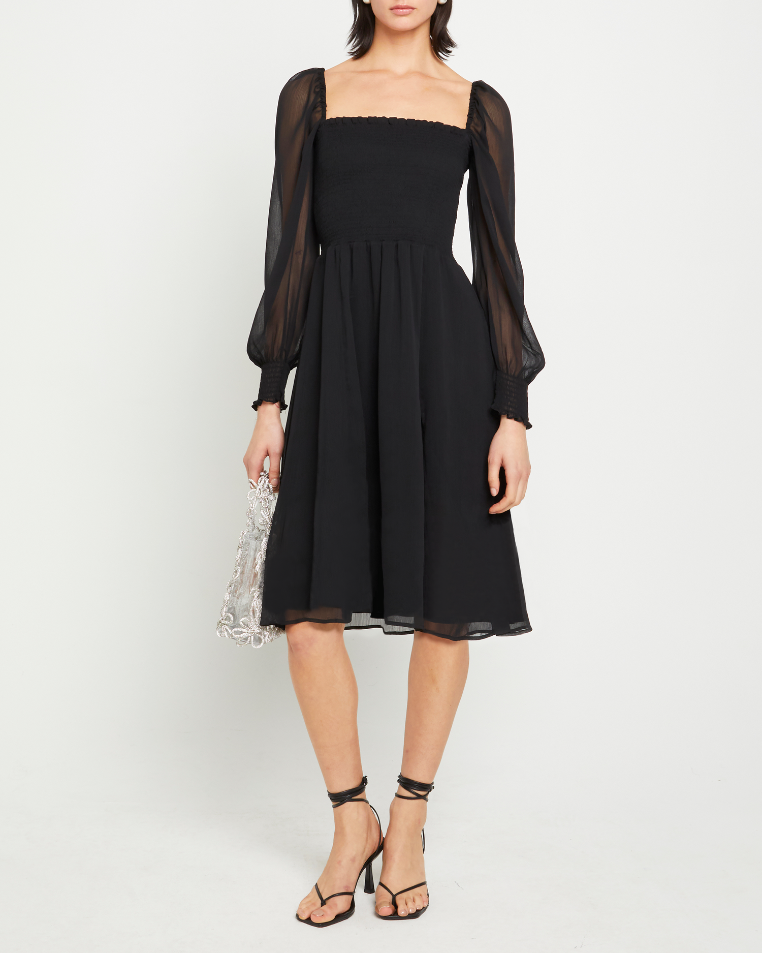 Fourth image of Classic Smocked Midi Dress, a black midi dress, side slit, long, sheer sleeves, puff sleeves, square neckline, smocked bodice