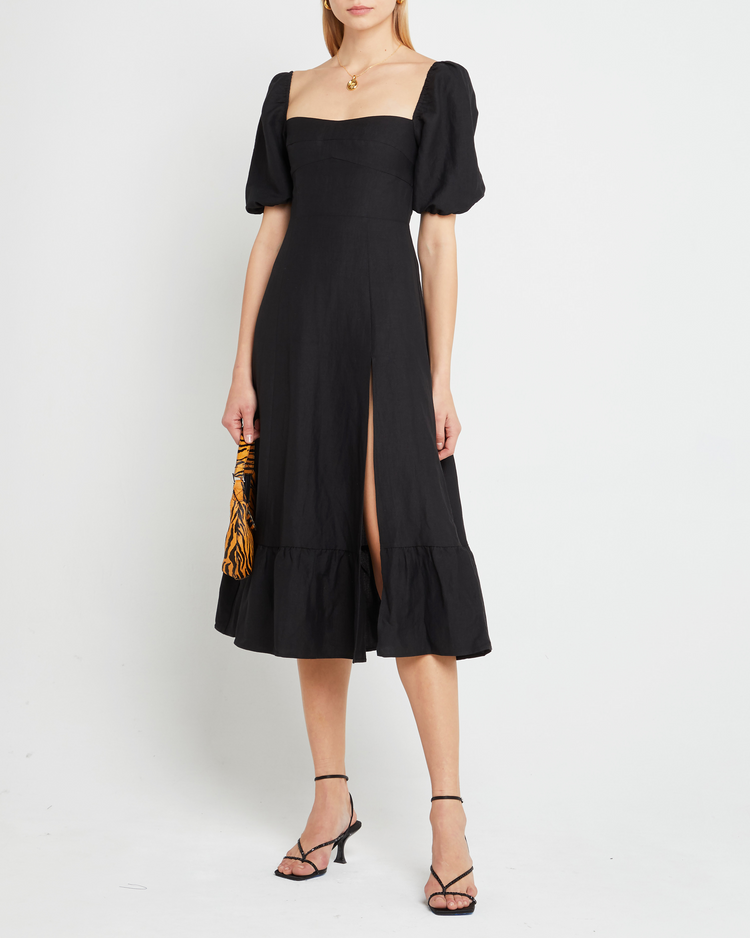 Third image of Violetta Midi Dress, a black midi dress, sweetheart neckline, short sleeves, puff sleeves, side slit