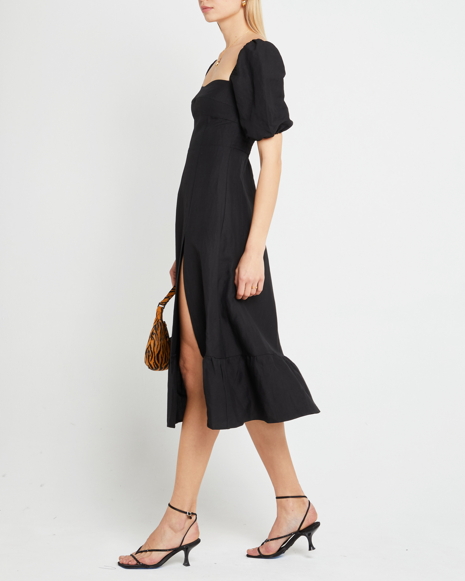 Fourth image of Violetta Midi Dress, a black midi dress, sweetheart neckline, short sleeves, puff sleeves, side slit