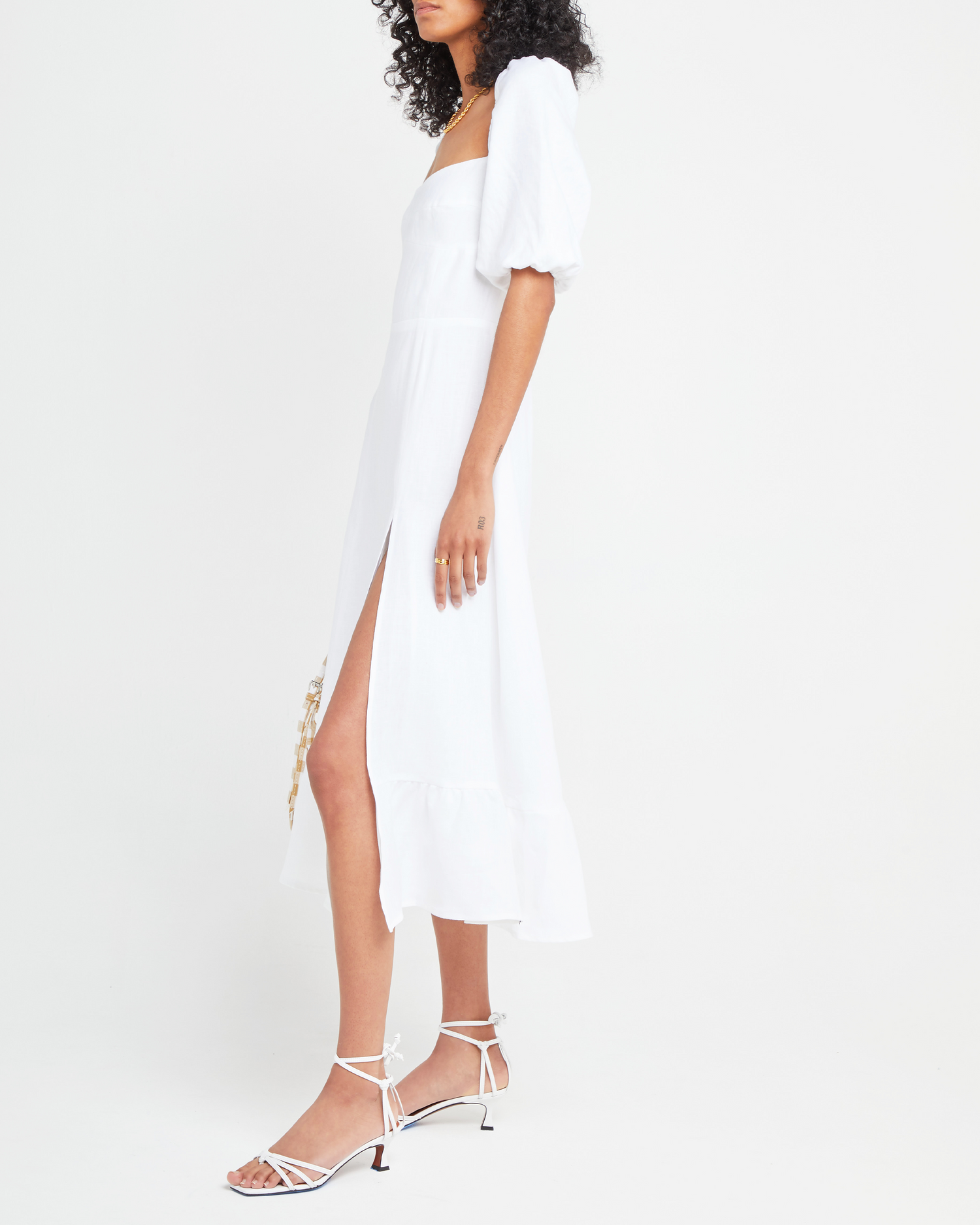 Fourth image of Violetta Midi Dress, a white midi dress, sweetheart neckline, short sleeves, puff sleeves, side slit